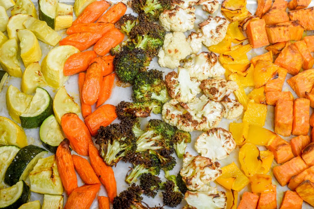 pan of roasted squash, zucchini, carrots, broccoli, cauliflower, and sweet potato