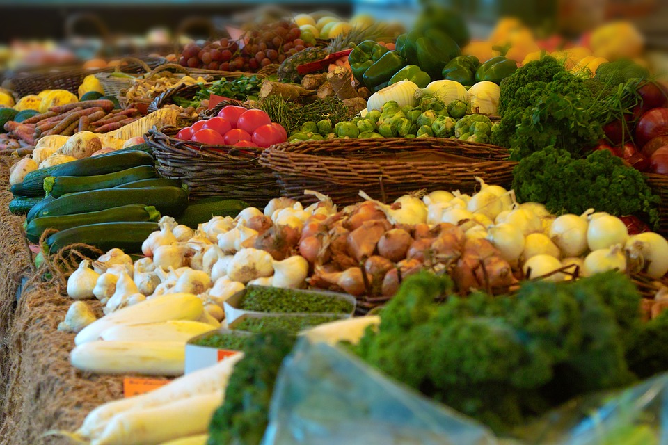 vegetables in bins at market